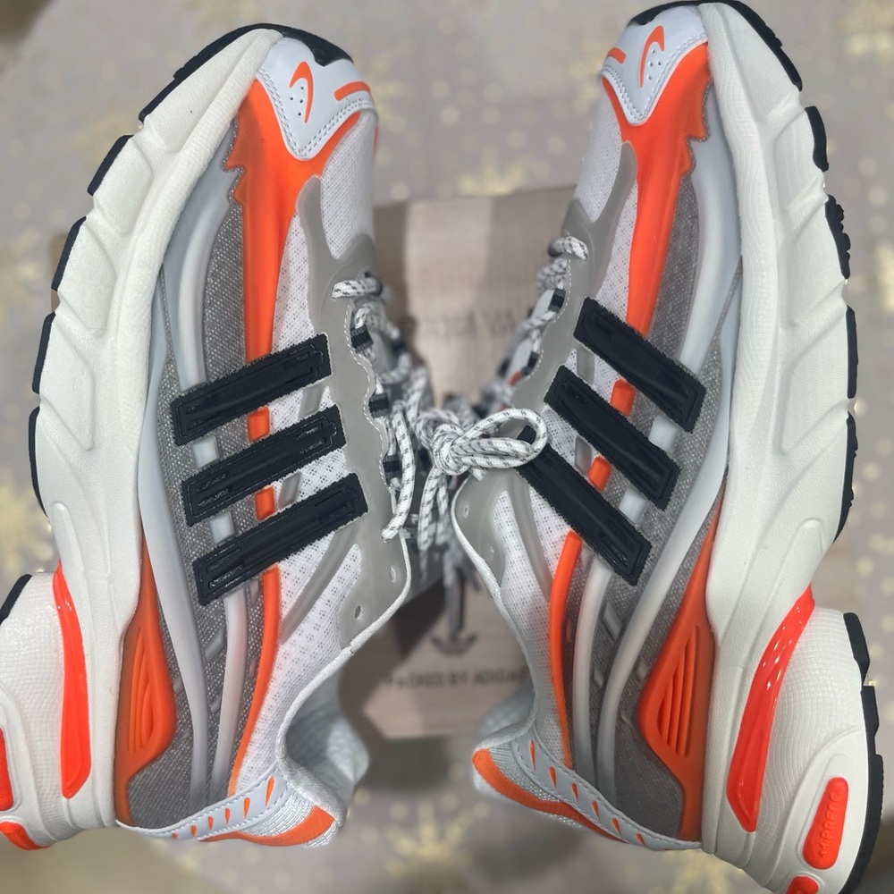 Adidas Adistar jellyfish Pharrell Williams 
White, Gray, and Orange Sneakers